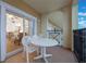 Private balcony with table and chairs, offering views of surrounding area at 8101 Resort Village Dr # 31308, Orlando, FL 32821