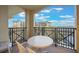 Private balcony with table and chairs, overlooking resort amenities at 8101 Resort Village Dr # 31308, Orlando, FL 32821