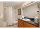 Bathroom with tub, shower, and granite vanity at 8101 Resort Village Dr # 31308, Orlando, FL 32821
