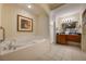Bathroom with soaking tub, shower, and double vanity at 8101 Resort Village Dr # 31308, Orlando, FL 32821