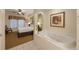 Ensuite bathroom with a large soaking tub and bedroom view at 8101 Resort Village Dr # 31308, Orlando, FL 32821