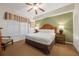 King bedroom with ceiling fan and ensuite bathroom access at 8101 Resort Village Dr # 31308, Orlando, FL 32821