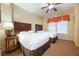 Bedroom with two twin beds and ceiling fan at 8101 Resort Village Dr # 31308, Orlando, FL 32821