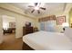 King bedroom with view into living room and dresser at 8101 Resort Village Dr # 31308, Orlando, FL 32821