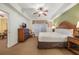 King bedroom with dresser, chair, and large window at 8101 Resort Village Dr # 31308, Orlando, FL 32821