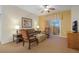 Comfortable living room with brown sofas and armchairs, access to balcony at 8101 Resort Village Dr # 31308, Orlando, FL 32821
