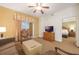 Living room with sofa, armchairs, and access to balcony and bedroom at 8101 Resort Village Dr # 31308, Orlando, FL 32821