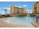 Resort-style pool with a pirate ship water feature and surrounding lounge chairs at 8101 Resort Village Dr # 31308, Orlando, FL 32821