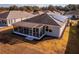 Rear view of house showcasing screened porch and solar panels at 8134 Sw 78Th Terrace Rd, Ocala, FL 34476