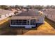 Home's back features a screened-in porch and solar panels at 8134 Sw 78Th Terrace Rd, Ocala, FL 34476