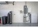 Interior of garage with Tesla Powerwall and water softener at 8134 Sw 78Th Terrace Rd, Ocala, FL 34476