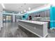 Modern kitchen with gray cabinets, white countertops and teal walls at 8134 Sw 78Th Terrace Rd, Ocala, FL 34476