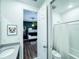 Bathroom with double sinks, a shower, and a view of bunk beds at 8953 Hilton Ridge Ave, Kissimmee, FL 34747