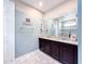 Bathroom with double vanity and walk-in shower at 8953 Hilton Ridge Ave, Kissimmee, FL 34747