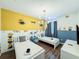 Bright bedroom with twin beds, Minion-themed decor, and modern lighting at 8953 Hilton Ridge Ave, Kissimmee, FL 34747