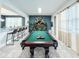 Game room features a pool table, bar, and seating at 8953 Hilton Ridge Ave, Kissimmee, FL 34747