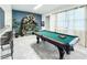 Game room with a pool table and stylish decor at 8953 Hilton Ridge Ave, Kissimmee, FL 34747