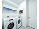 Laundry room with Whirlpool washer and dryer at 8953 Hilton Ridge Ave, Kissimmee, FL 34747