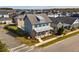 Two-story home with blue shutters, front porch, and pool at 9203 Neher St, Orlando, FL 32827