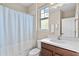 Clean bathroom with a shower/tub combo and a vanity with a sink at 9203 Neher St, Orlando, FL 32827