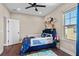 bedroom with full-size bed and space for play at 9203 Neher St, Orlando, FL 32827