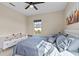 Bright bedroom with a queen-size bed and plenty of closet space at 9203 Neher St, Orlando, FL 32827