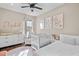 Bright Bedroom with crib, dresser, and comfortable armchair at 9203 Neher St, Orlando, FL 32827