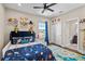 bedroom with a full-size bed and space for play at 9203 Neher St, Orlando, FL 32827