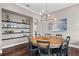 Dining room with round table, chairs, and built-in shelves at 9203 Neher St, Orlando, FL 32827