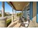 Front porch with seating area and view of the street at 9203 Neher St, Orlando, FL 32827