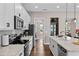 Modern kitchen with stainless steel appliances and white cabinets at 9203 Neher St, Orlando, FL 32827