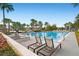 Community lap pool with ample lounge chairs at 9203 Neher St, Orlando, FL 32827