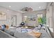 Living room with sectional sofa and large windows at 9203 Neher St, Orlando, FL 32827