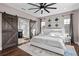 Main bedroom with barn doors, ceiling fan, and ample natural light at 9203 Neher St, Orlando, FL 32827