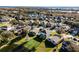 An aerial shot of a house nestled in a community by a lake at 9657 Pacific Pines Ct, Orlando, FL 32832