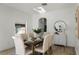 Elegant dining room featuring a wooden table and beige chairs at 9657 Pacific Pines Ct, Orlando, FL 32832