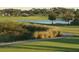 Golf course with pond and walking path at 9657 Pacific Pines Ct, Orlando, FL 32832