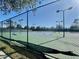 Community tennis courts with chain link fence at 9657 Pacific Pines Ct, Orlando, FL 32832