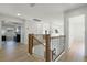 Upstairs hallway with wood flooring and access to bedrooms at 9657 Pacific Pines Ct, Orlando, FL 32832