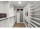 Large walk-in closet with ample shelving and hanging space at 9657 Pacific Pines Ct, Orlando, FL 32832