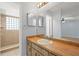 Bathroom boasts a wood vanity and large mirror at 1163 Queen Elaine Dr, Casselberry, FL 32707