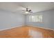 Bright bedroom featuring wood-look floors and a ceiling fan at 1163 Queen Elaine Dr, Casselberry, FL 32707