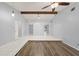 Spacious living room with wood-look flooring and high ceilings at 1163 Queen Elaine Dr, Casselberry, FL 32707
