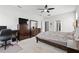 Bright bedroom with a large dresser, work station, and comfortable bed at 1172 Degraw Dr, Apopka, FL 32712