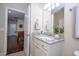 Well-appointed bathroom with granite vanity and game room view at 12088 Uleta Ln, Orlando, FL 32827