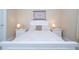 Bedroom with queen bed and white nightstands at 12088 Uleta Ln, Orlando, FL 32827