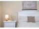 Bedroom with queen bed and white nightstands at 12088 Uleta Ln, Orlando, FL 32827