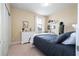 Bedroom with queen bed and white dresser at 12088 Uleta Ln, Orlando, FL 32827