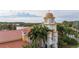 Elegant community clubhouse with clock tower and Spanish tile roof at 12088 Uleta Ln, Orlando, FL 32827
