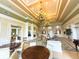 Spacious community room with elegant chandelier and seating areas at 12088 Uleta Ln, Orlando, FL 32827